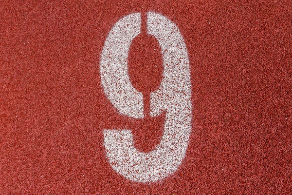 "9" Numbers on red running track — Stock Photo, Image