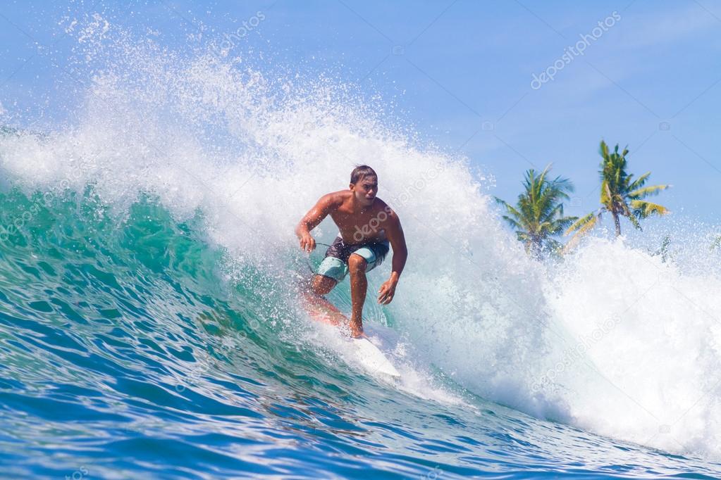 Surfing a Wave. Bali Island. Indonesia. — Stock Photo © trubavin 47436863