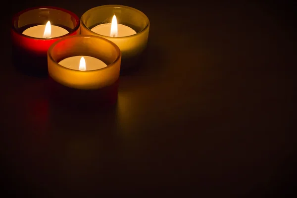 Trio of tea-lights with text space — Stock Photo, Image