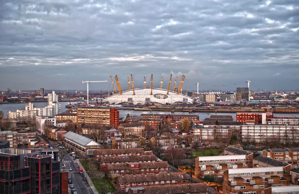 LONDON, UK - MARCH 05, 2014: view on O2 dome, millennium Dome, main arena for pop performances and show events. Residential site of local docks in front — Stock Photo, Image