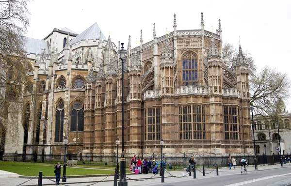 LONDON, WESTMINSTER, UK - APRIL 05, 2014 Houses of Parliament and Parliament tower, view from the Abingon St Royalty Free Stock Photos