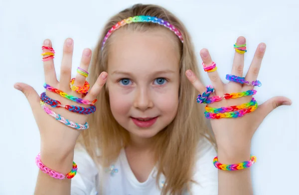 Loom bags craft. Little girl demonstrating her works. — Stock Photo, Image