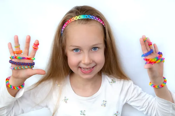 Loom bags craft. Little girl demonstrating her works. — Stock Photo, Image