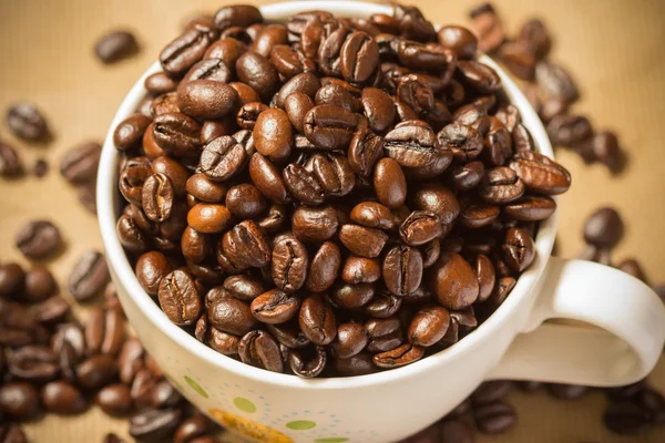 Roasted coffee seed coffee cup background