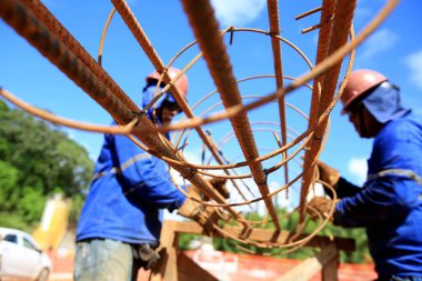 salvador, bahia, brazil - march 23, 2017: Workers working on construction of a bus station in Salvador city.