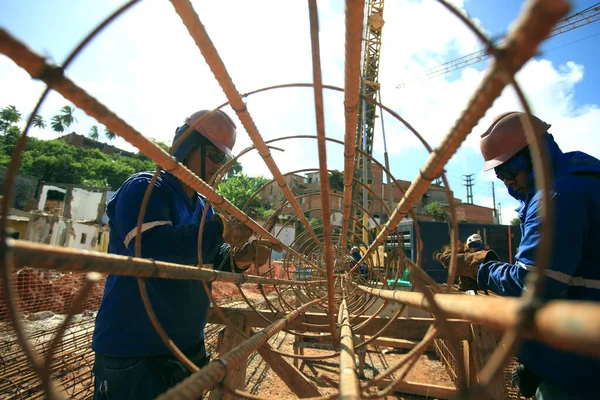 salvador, bahia, brazil - march 23, 2017: Workers working on construction of a bus station in Salvador city.