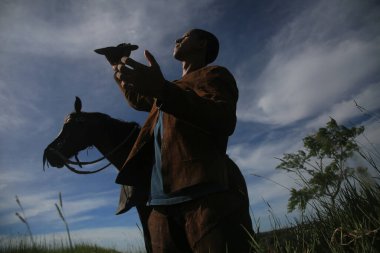 conde, bahia, brasil - january 8, 2022: Cowboy wearing traditional leather clothes with his horse on a farm in the city of Conde.
