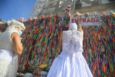 salvador, bahia, brazil - january 13, 2022: adept of the Candomble religion seen during a visit to the Basilica of Senhor do Bonfim in the city of Salavdor.