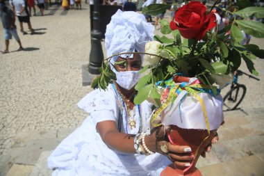 salvador, bahia, brazil - january 13, 2022: baiana with typical clothes during a visit to the Basilica of Senhor do Bonfim in the city of Salvador.