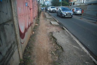 salvador, bahia, brazil - july 19, 2022: Pedestrian sidewalk with damaged floor on a street in Salvador city.