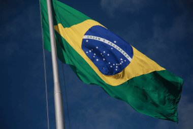 salvador, bahia, brazil - august 25, 2022: Brazil flag on a flagpole of a supermarket in Cabula neighborhood in Salvador city.