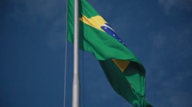 salvador, bahia, brazil - august 25, 2022: Brazil flag on a flagpole of a supermarket in Cabula neighborhood in Salvador city.