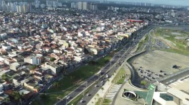 salvador, bahia, brazil - august 16, 2022: aerial view of houses in a favela area in the Boca do Rio neighborhood in the city of Salvador.