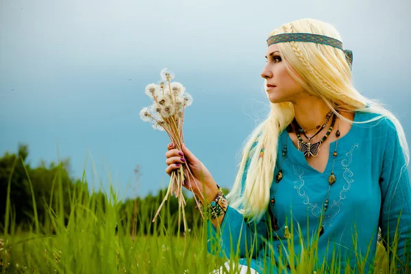 Blonde with dandelions — Stock Photo, Image