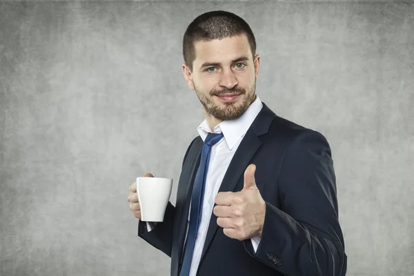 Smiling businessman recommend coffee — Stock Photo, Image