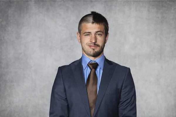 Portrait of a half smiling businessman — Stock Photo, Image