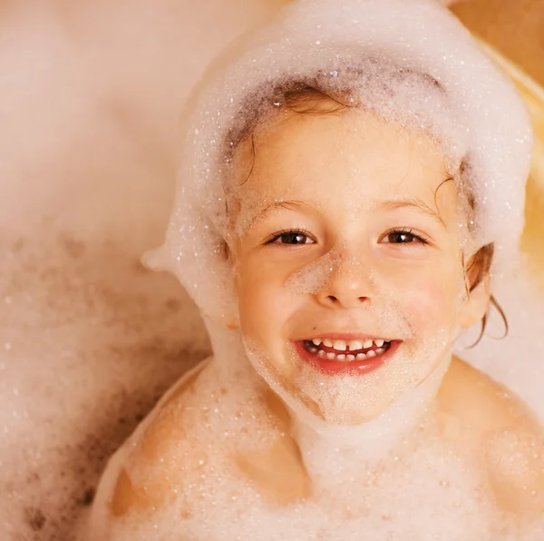 Cute little boy in bathroom with foam Stock Photo by ©iordani 59594605
