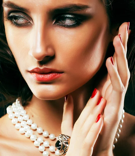 beauty rich woman with bright makeup wearing luxury jewellery on black background, fashion lady