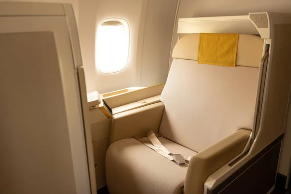 Luxury first class or business class suite on airplane in gold color feel private for travel.Business comfort and eleglance chair when fly with airline.