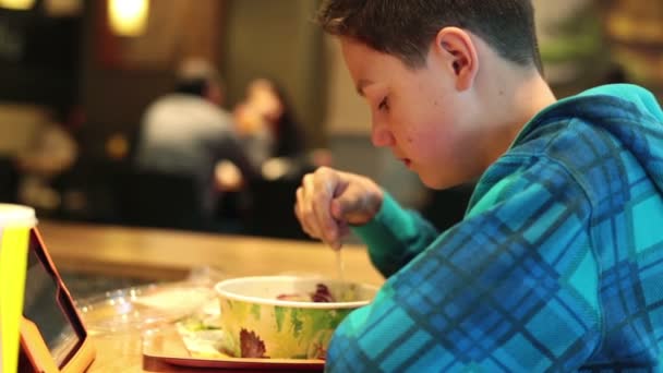 Boy eating salad — Stock Video