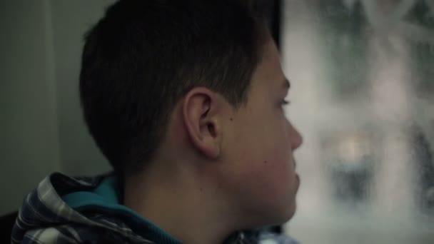 Sad pensive boy riding bus — Stock Video