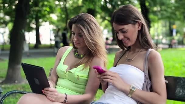 Girlfriends with tablet and smartphone — Stock Video