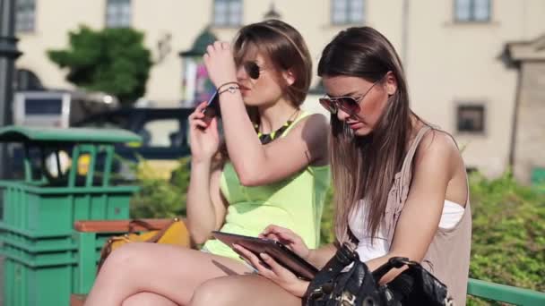 Girlfriends with cellphone and tablet — Stock Video