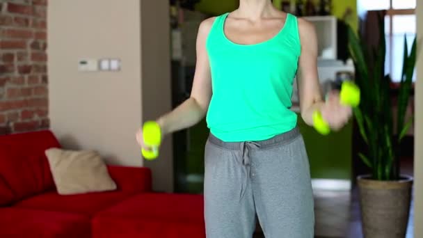 Woman exercising with dumb-bells — Stock Video