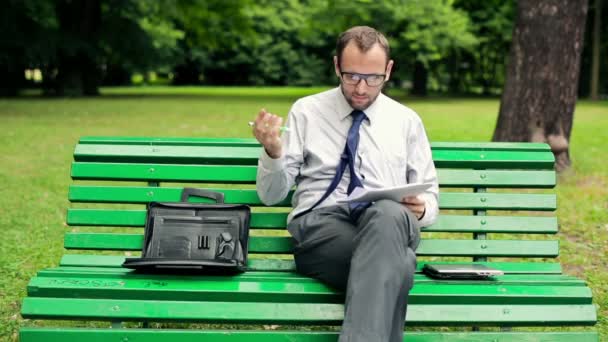 Businessman working with documents — Stock Video