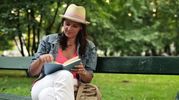 Woman finishing reading book — Stock Video