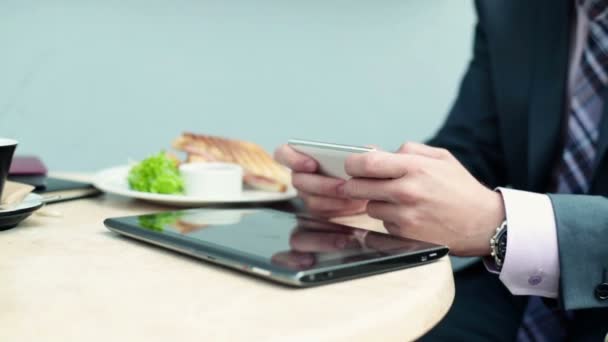 Businessman with smartphone and tablet computer — Stock Video