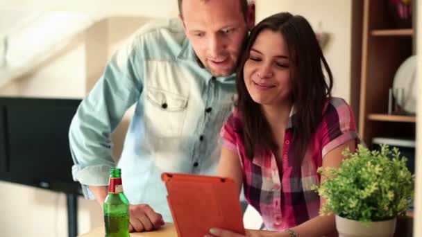 Couple with tablet computer at home — Stock Video