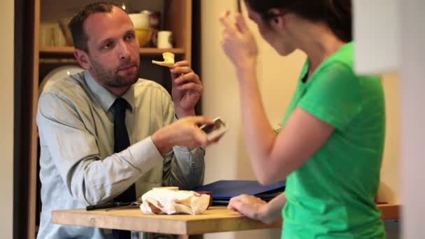 Businessman talking to his wife during breakfast — Stock Video