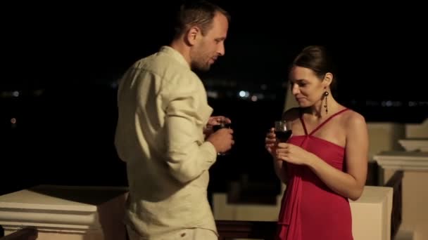 Couple drinking wine on terrace — Stock Video