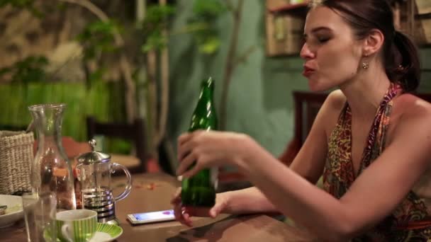 Sad attractive woman drinking beer — Stock Video