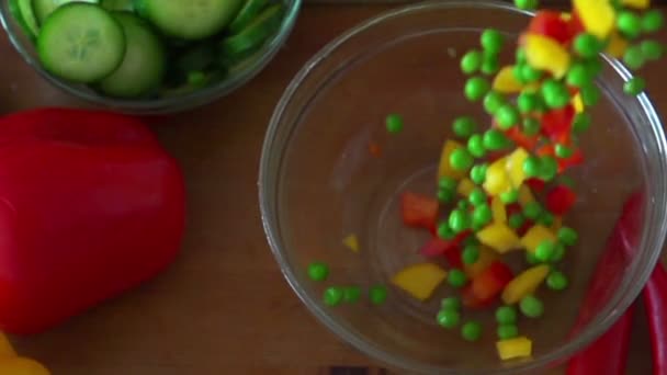 Vegetables falling into bowl — Stock Video