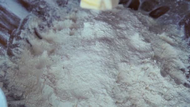 Butter falling into heap of flour — Stock Video