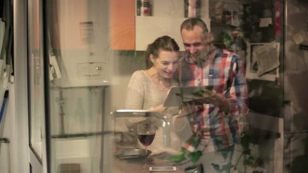 Couple with tablet drink wine — Stock Video