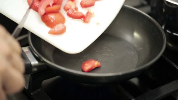Frying chopped tomatoes — Stock Video