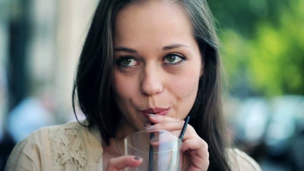 Woman drinking tasty cocktail in cafe — Stock Video