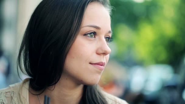 Pensive woman sitting alone in cafe — Stock Video