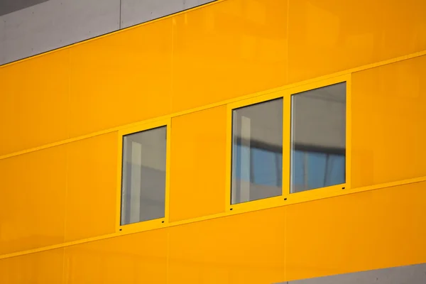 Modern office buildings. Colorful buildings in a industrial place. Orange windows. — Stock Photo, Image