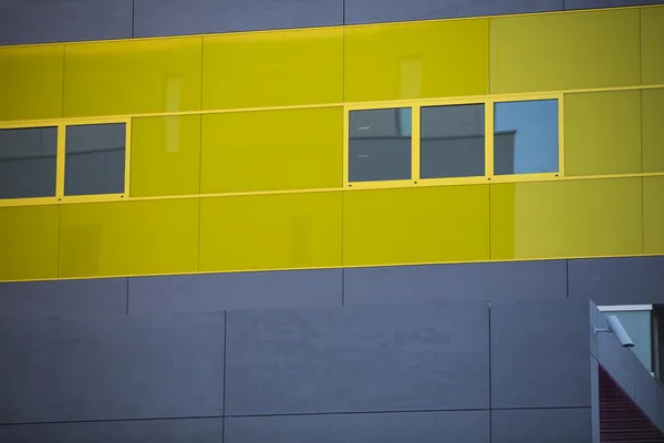 Modern office buildings. Colorful buildings in a industrial place. Yellow windows. — Stock Photo, Image