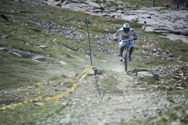 GRANADA, SPAIN - JUNE 30: Unknown racer on the competition of the mountain downhill bike 