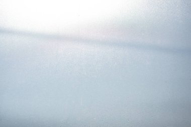 Soyut arkaplan, ışığın karakteristik özellikleri yüzeye çarpar, gürültü ve tahıl dokusuna neden olur.