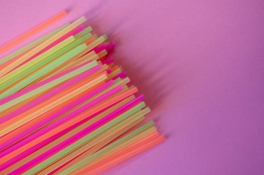 Assortment of neon colored plastic straws 