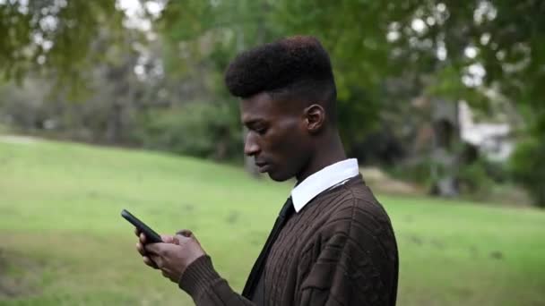 Man Seen Using His Mobile Phone Outdoors — 图库视频影像