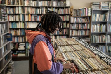 Woman seen going through vinyl records