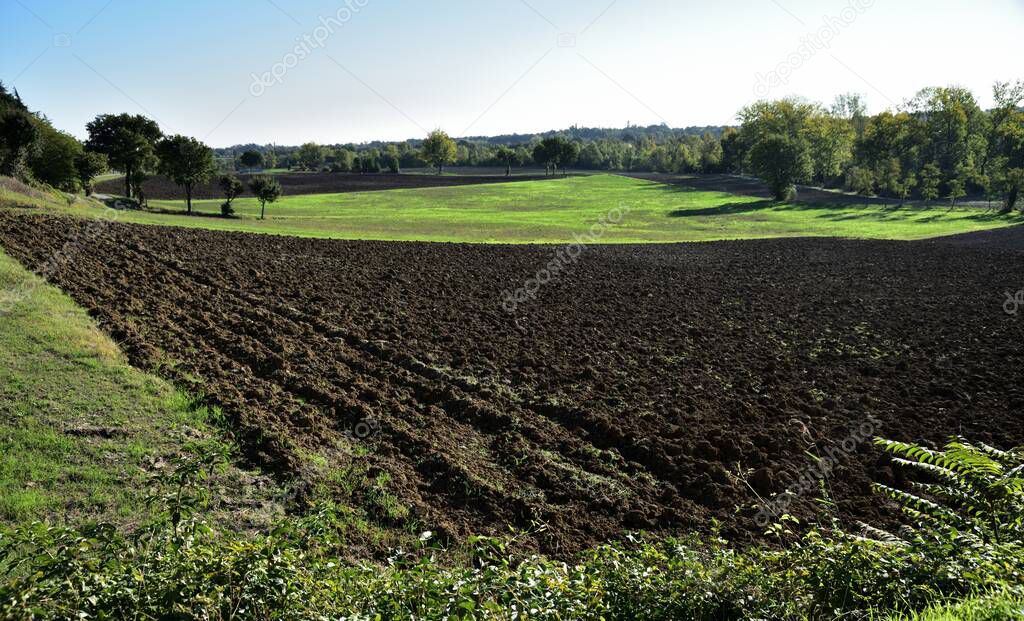 Fields plowed and ready for autumn sowing in the small plains close to the Apennines