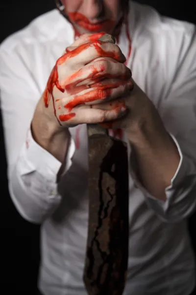 Man holding bloody knife in hand — Stock Photo, Image